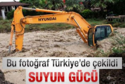 Sel iş makinesini böyle sürükledi 